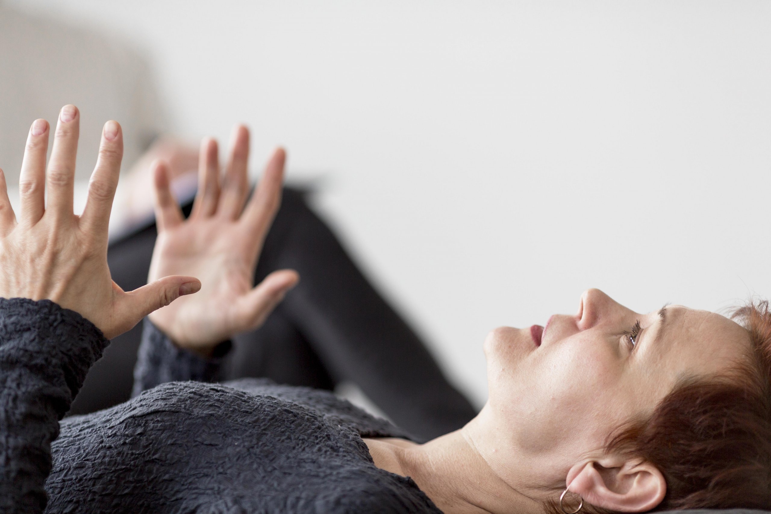 front-view-patient-laying-back-talking